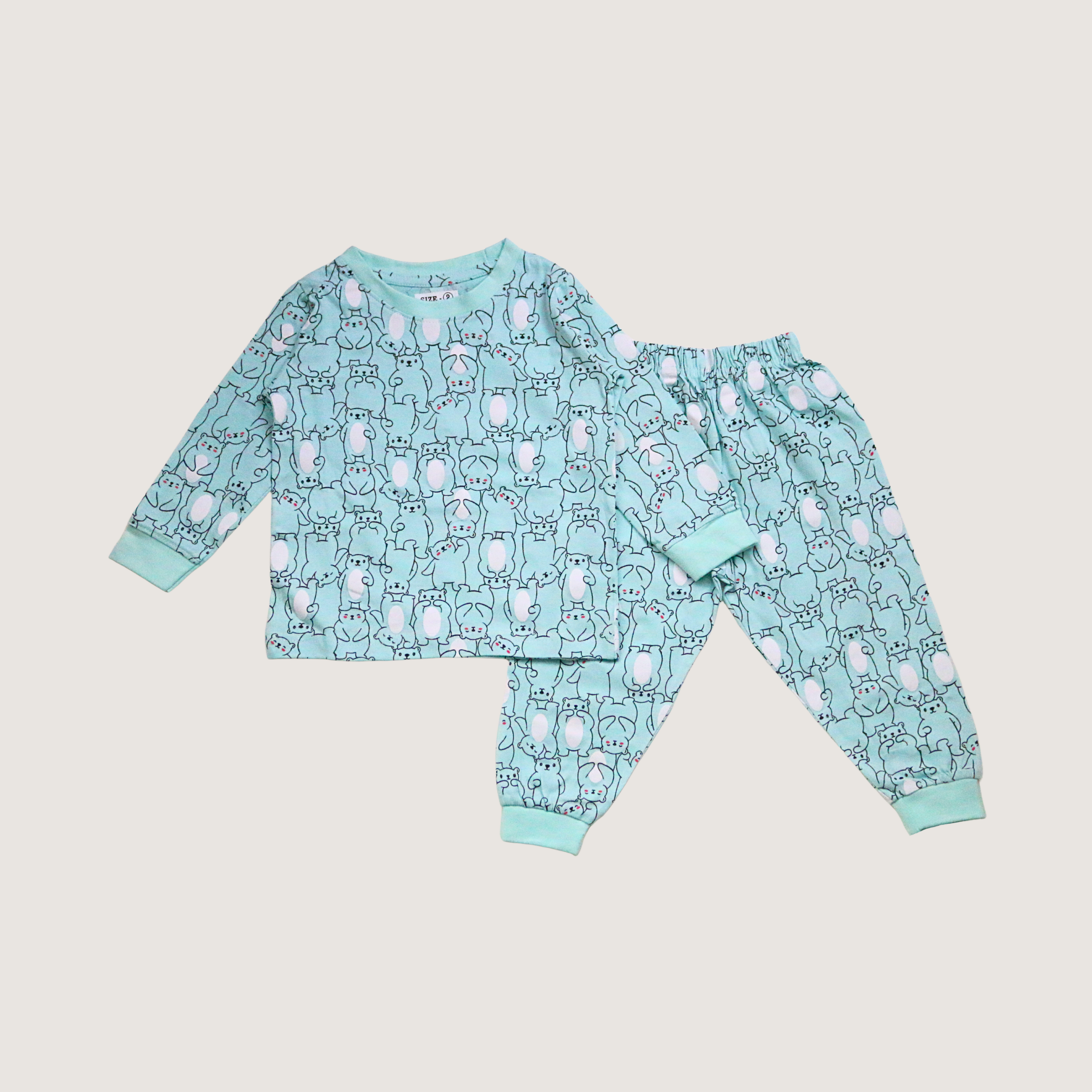 Children's pajama set with animal pattern on a light gray background