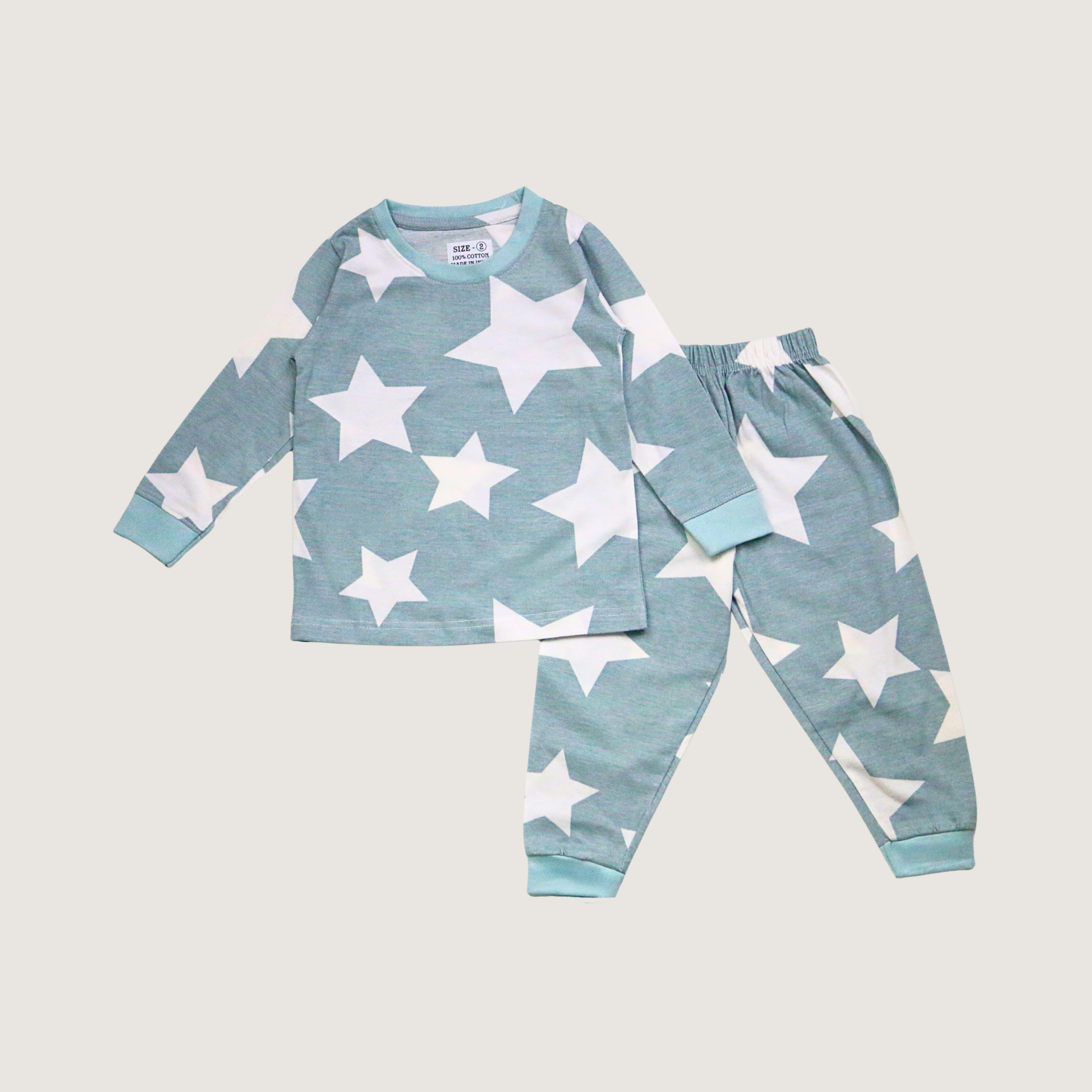Children's pajama set with white star patterns on a light blue background