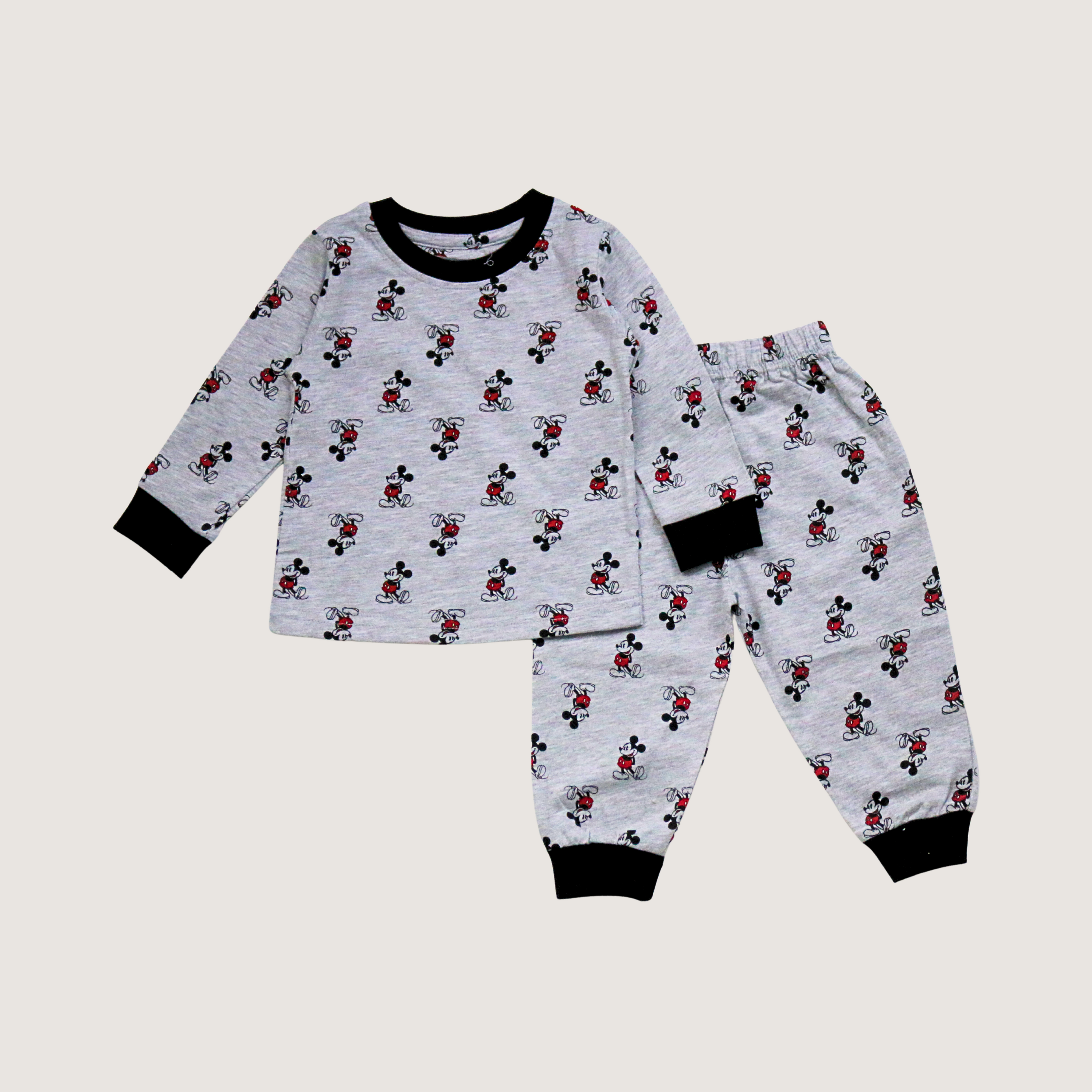 Children's pajama set with cartoon pattern on a light gray background