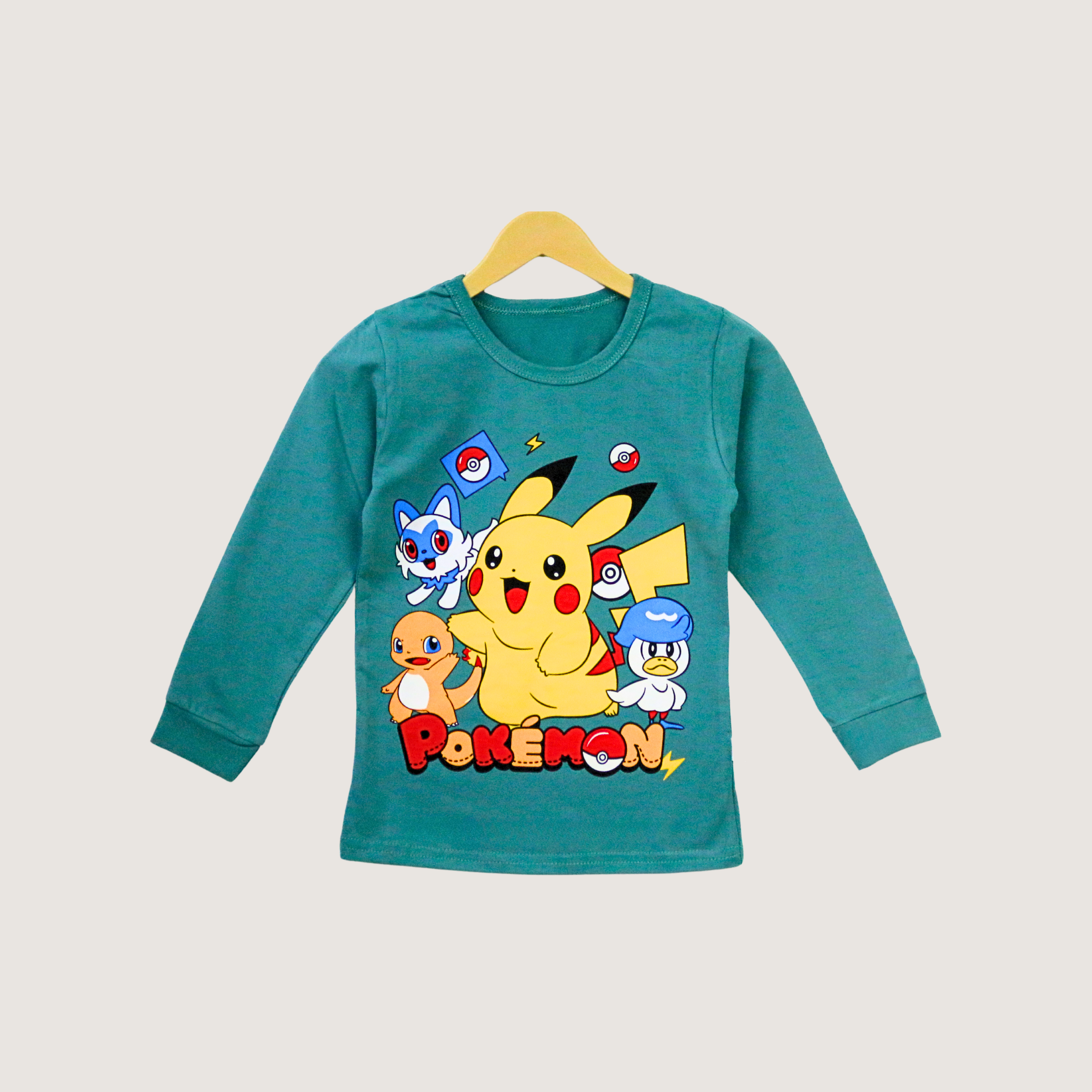 Teal long-sleeve shirt with Pokemon characters on a beige background