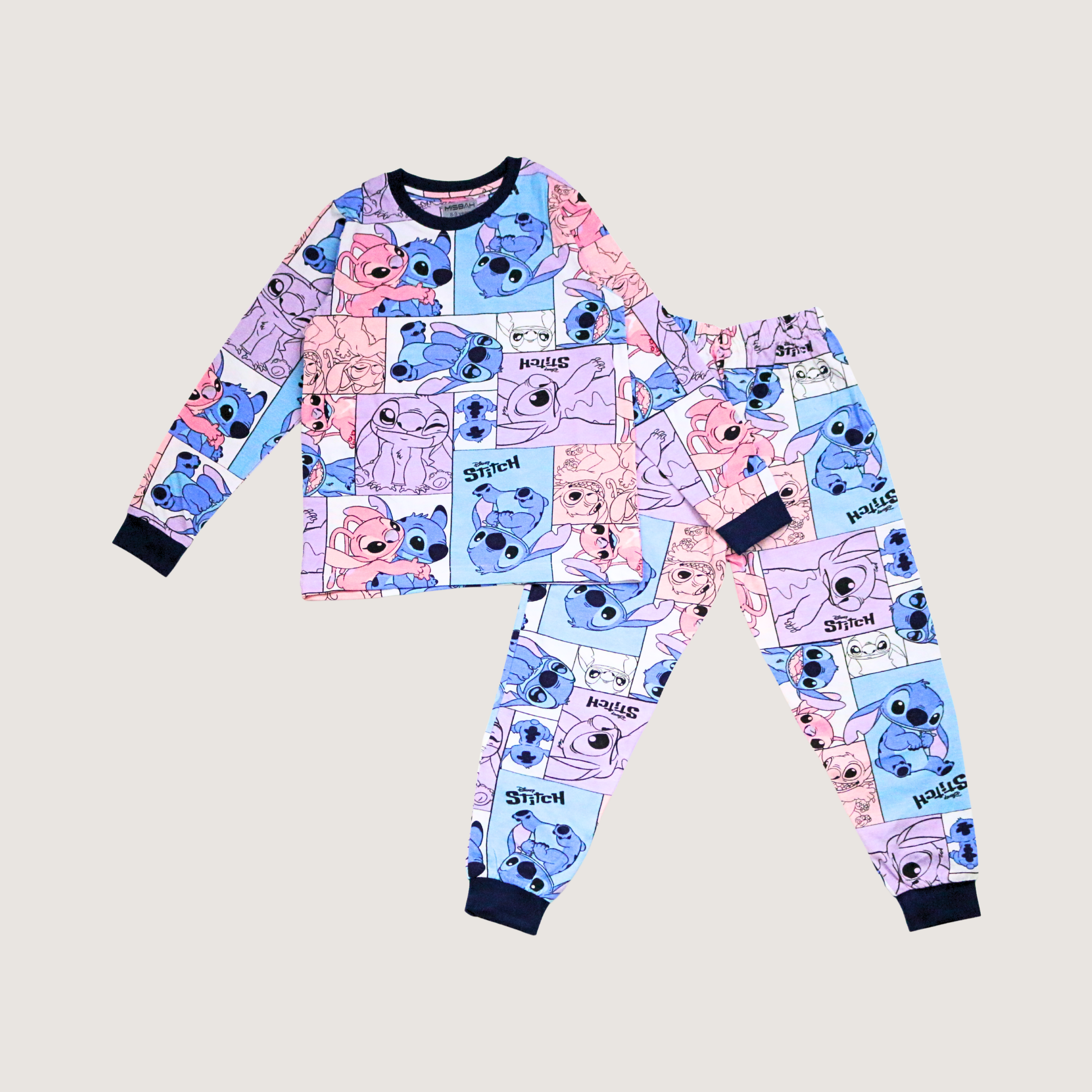 Children's pajama set with cartoon character pattern on a beige background