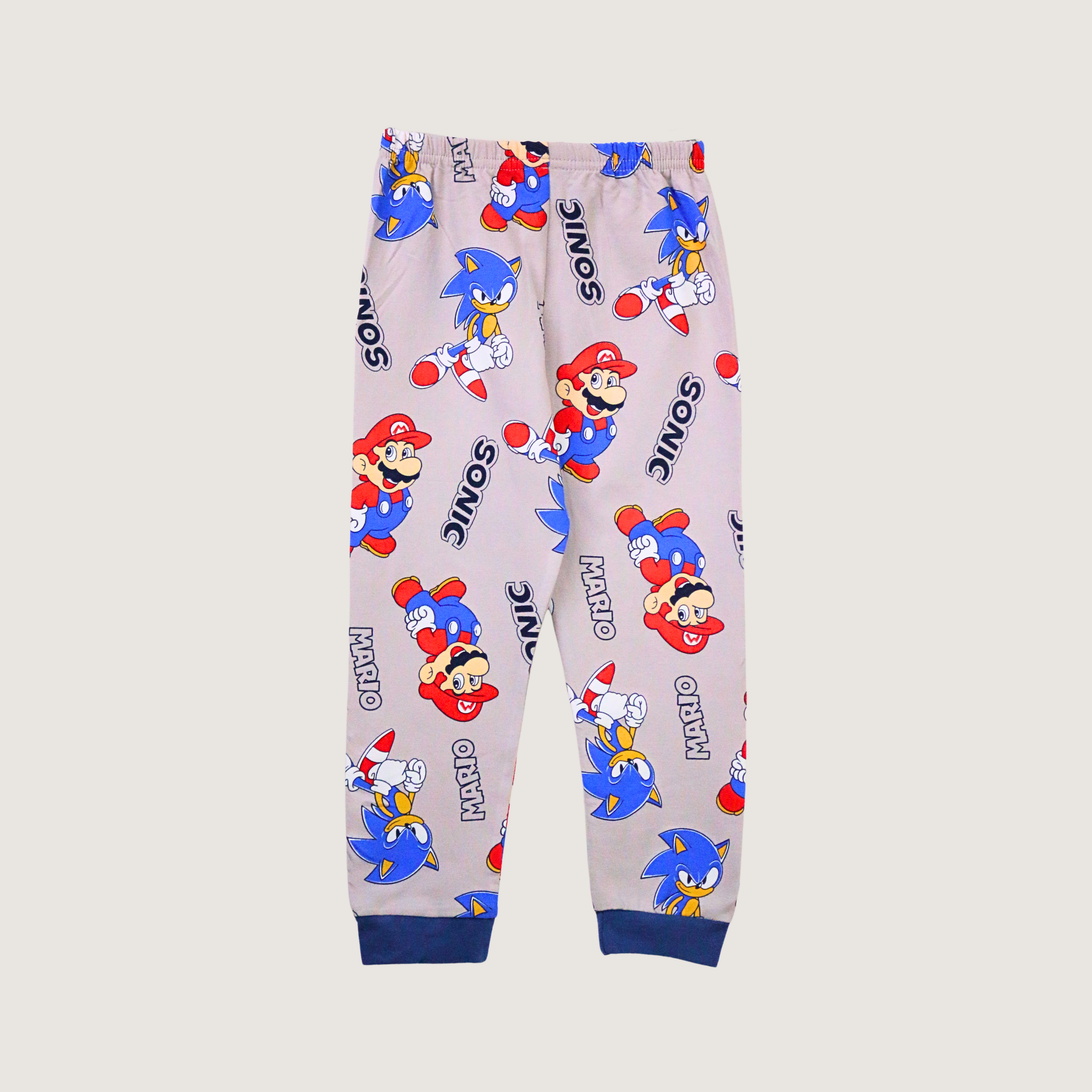 Children's pants with Mario and Sonic character prints on a light gray background