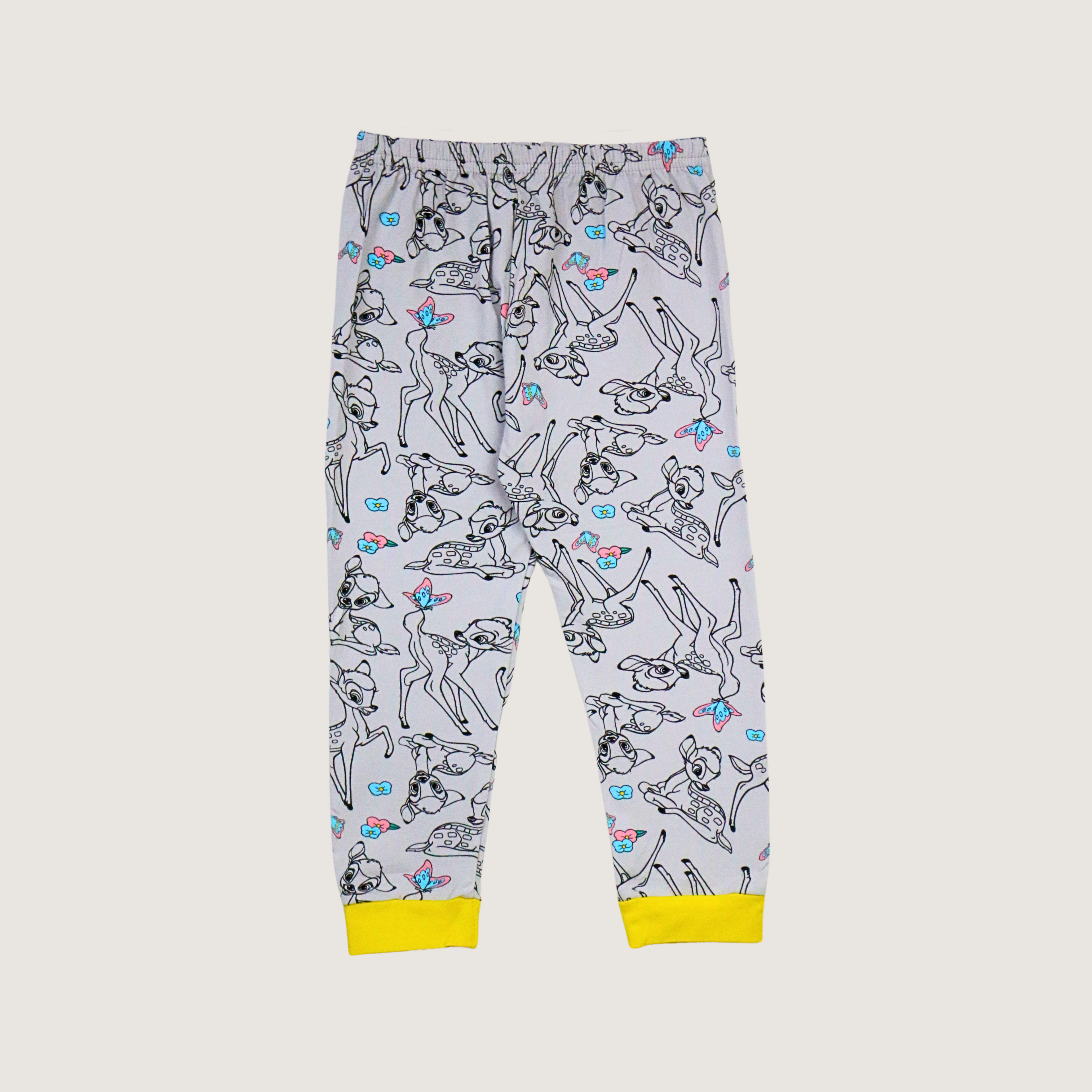 Children's pajama pants with a cartoon dog pattern on a light gray background
