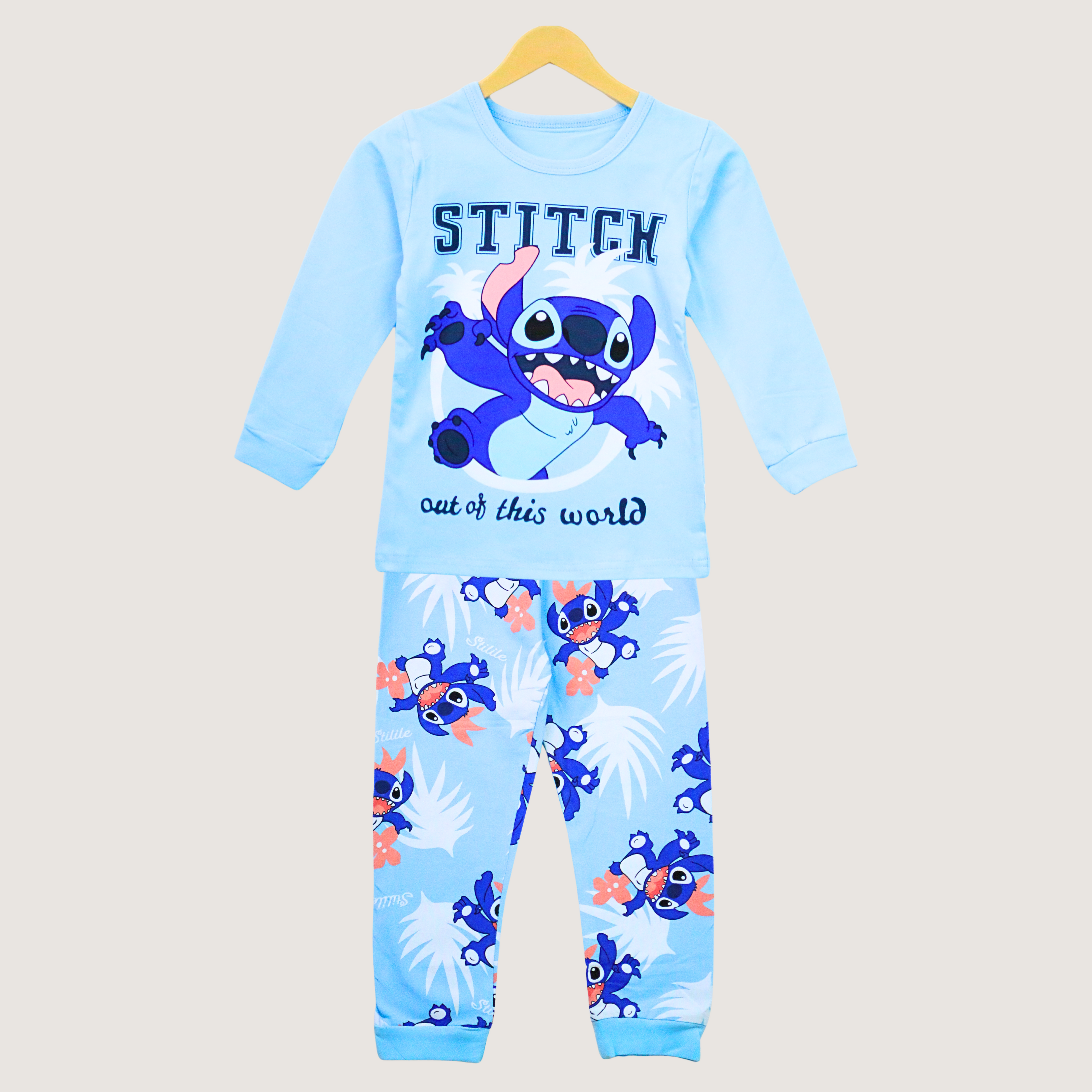 Children's pajama set with Stitch design on a beige background