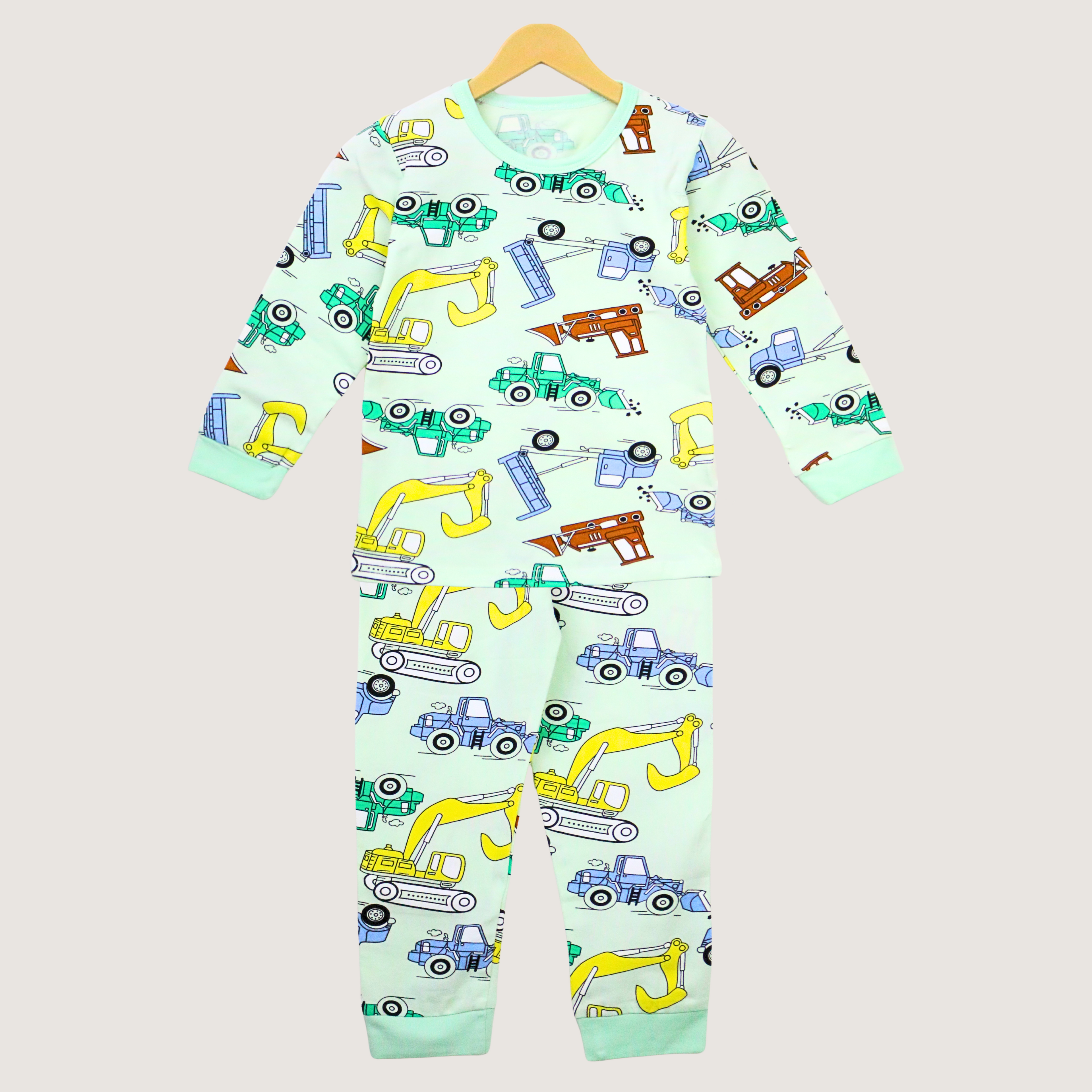Children's onesie with vehicle pattern on a light gray background