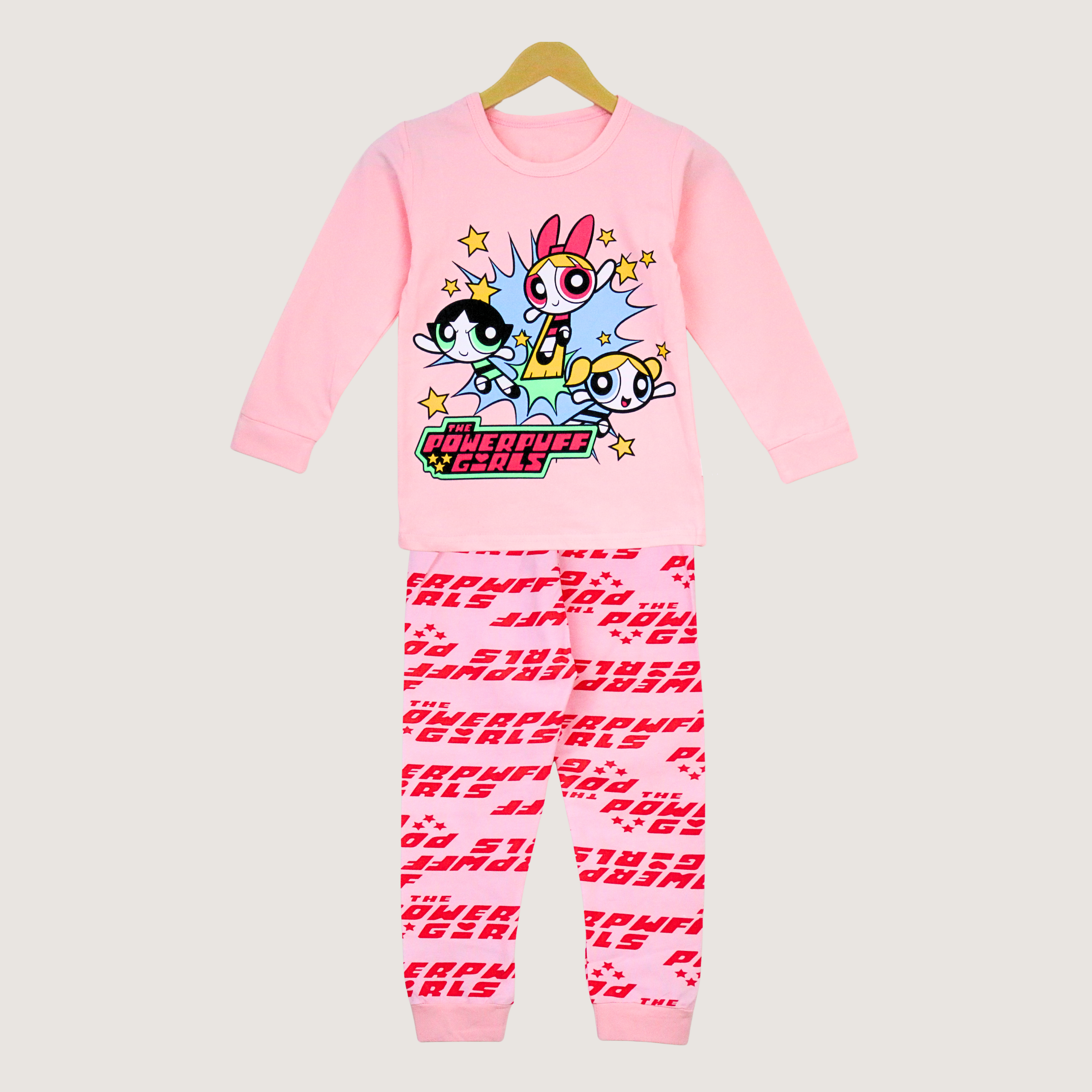 Pink children's pajama set with Powerpuff Girls design on a light gray background