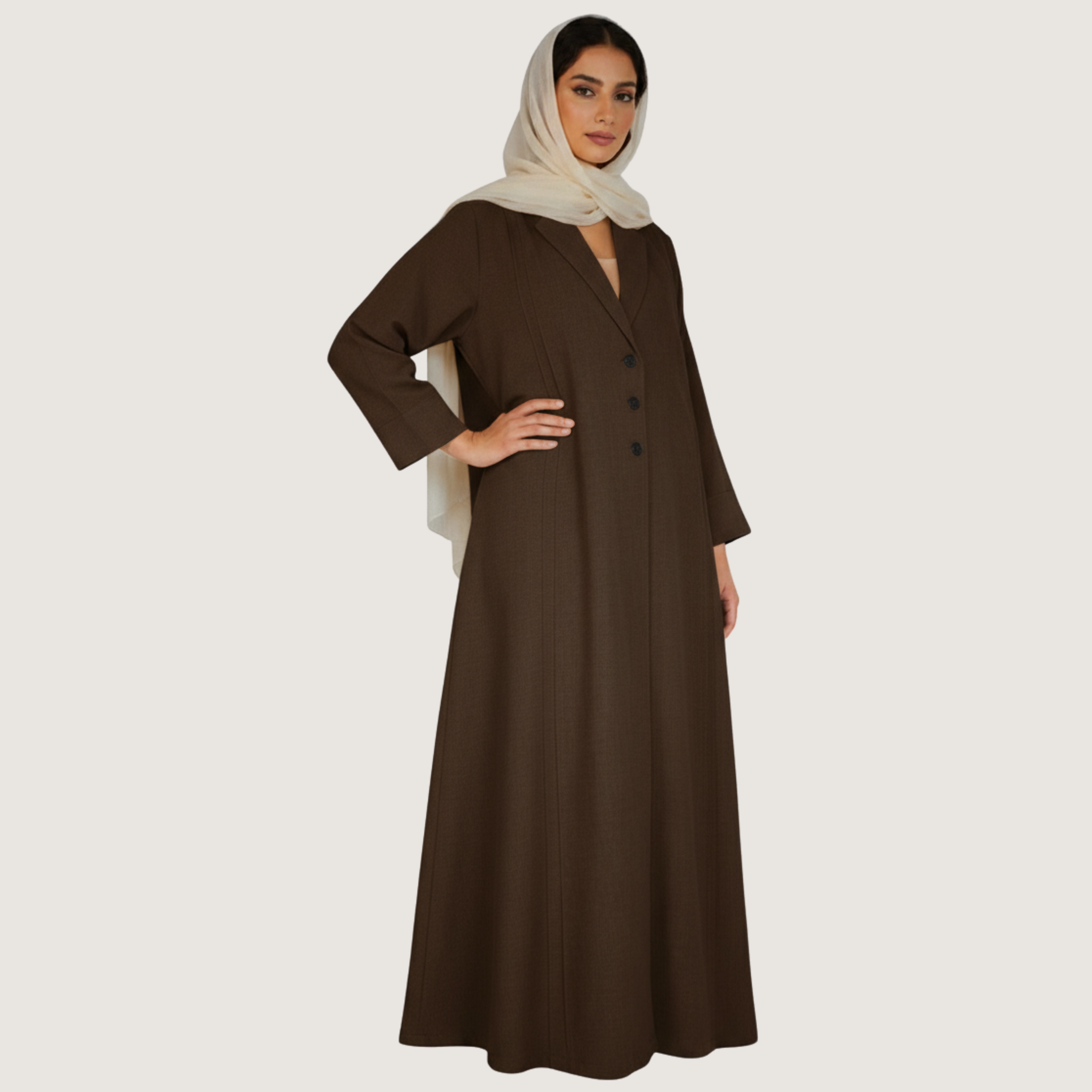 Woman wearing a brown dress with a beige hijab on a white background