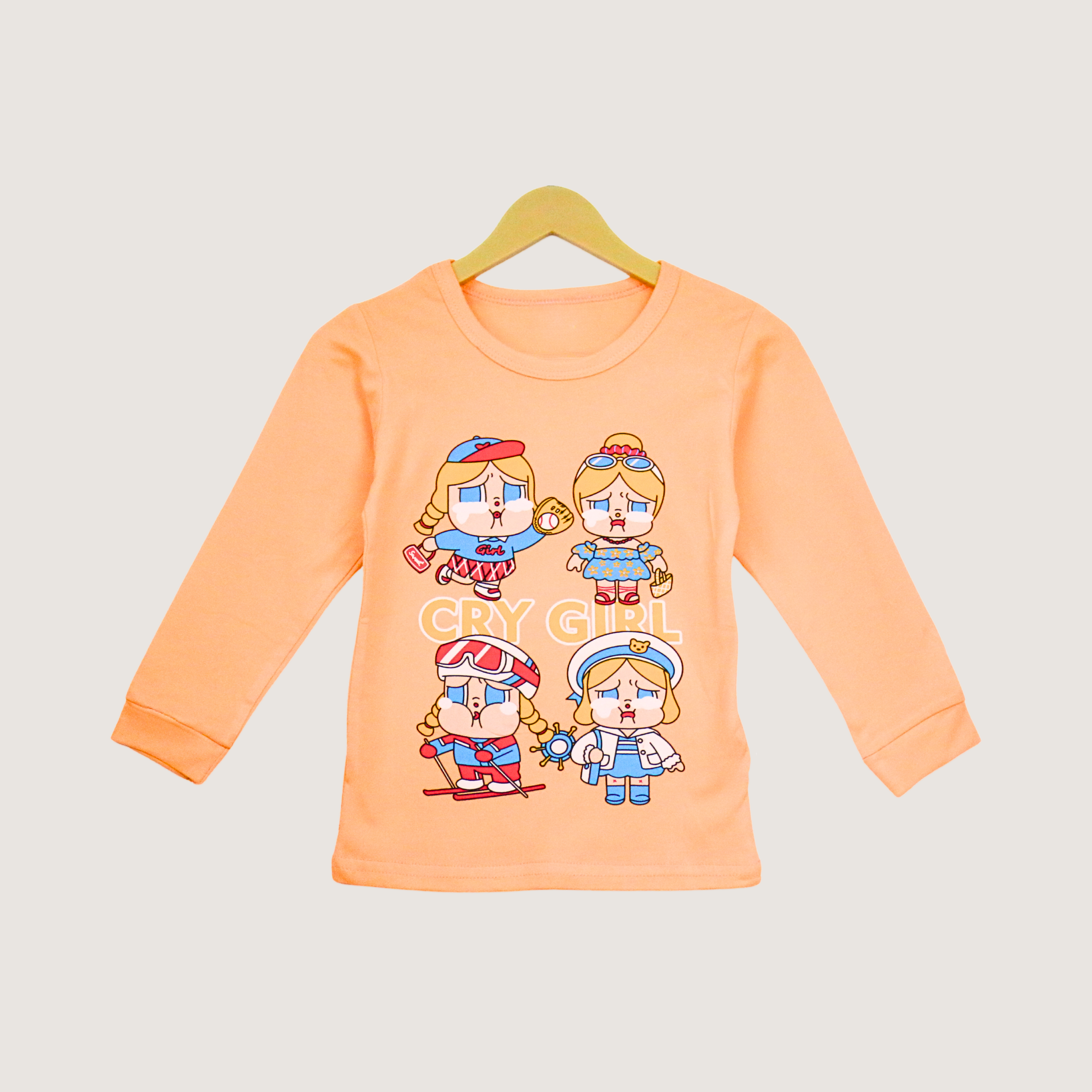 Children's long-sleeve shirt with cartoon characters on a hanger against a light gray background