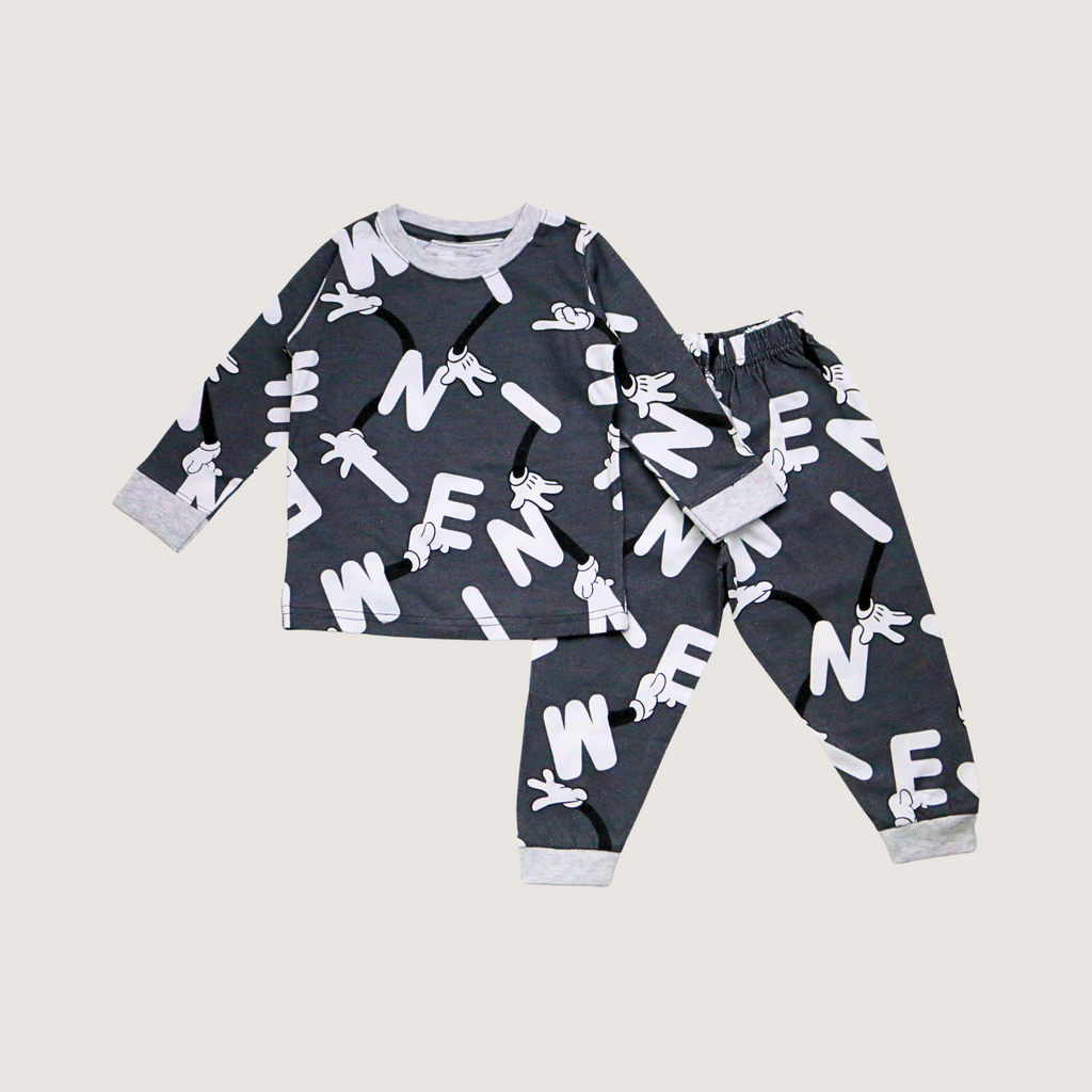 Children's pajama set with white text and graphics on a gray background