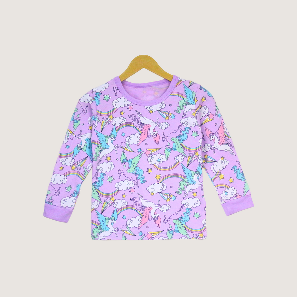 Purple long-sleeve shirt with unicorn and rainbow pattern on a beige background