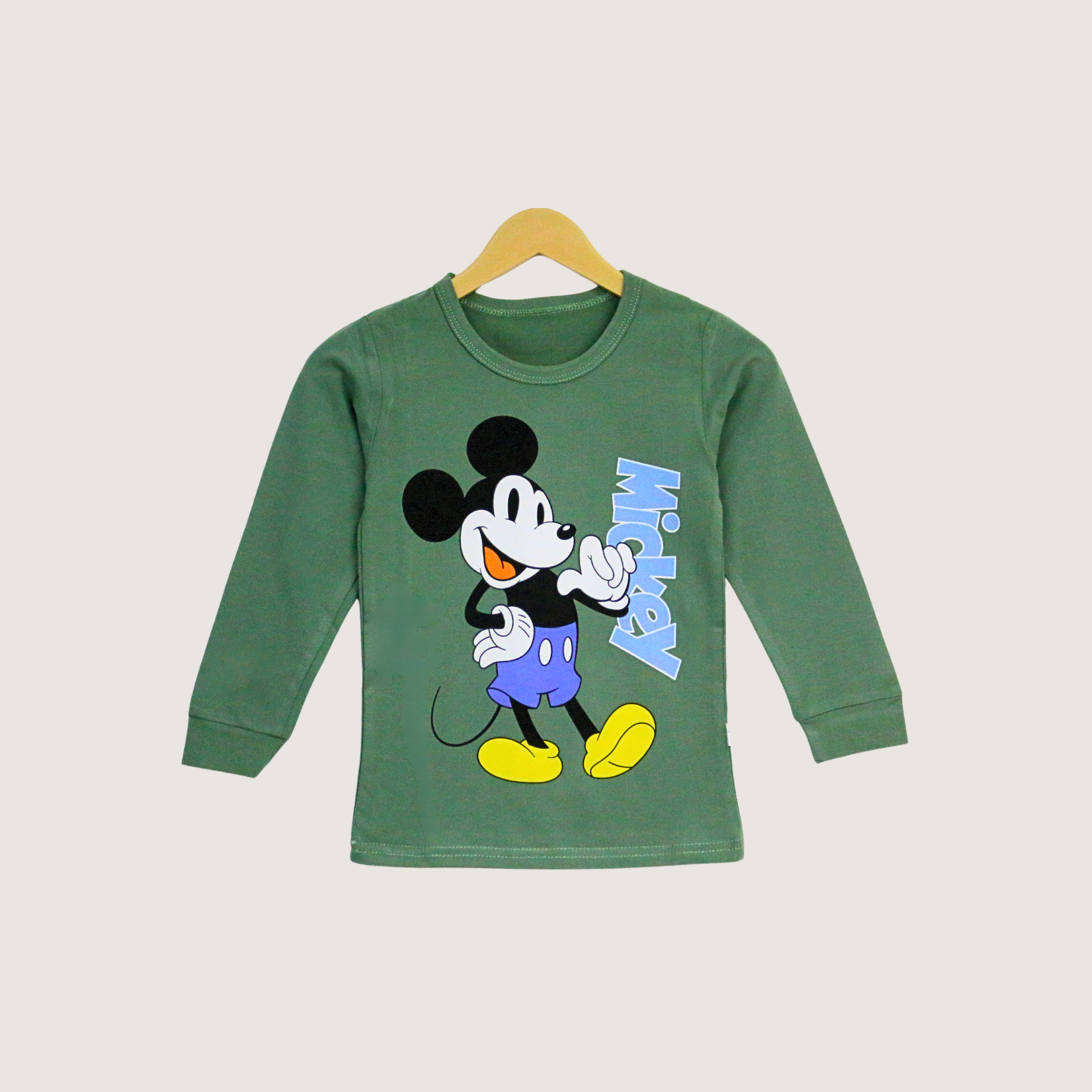 Green long-sleeve shirt with Mickey Mouse design on a beige background