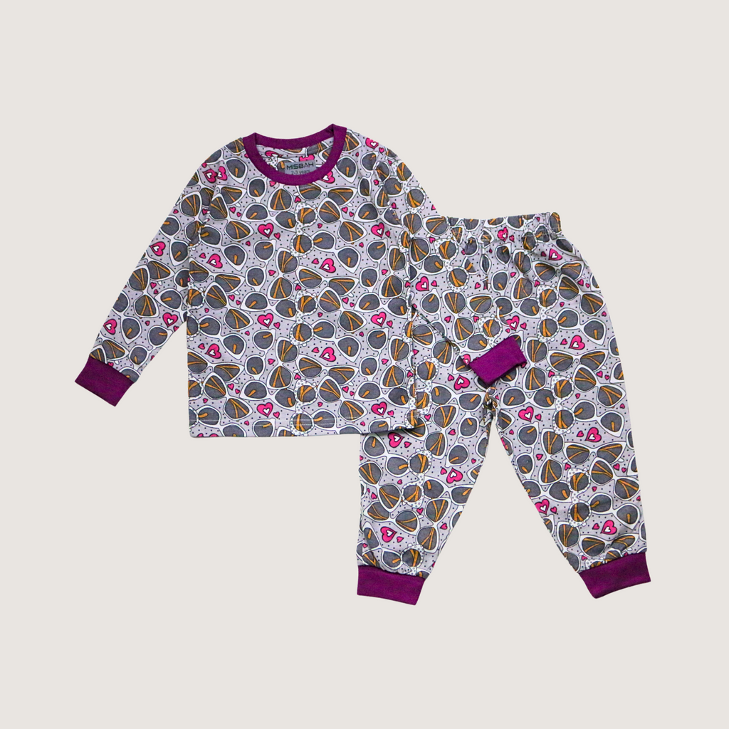 Children's pajama set with butterfly pattern on a light gray background