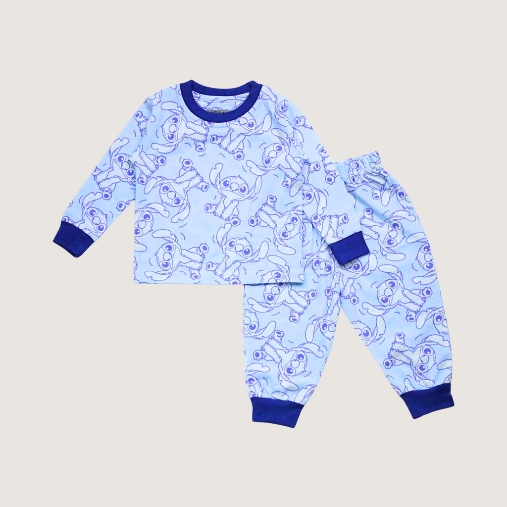 Children's pajama set with blue and white pattern on a beige background