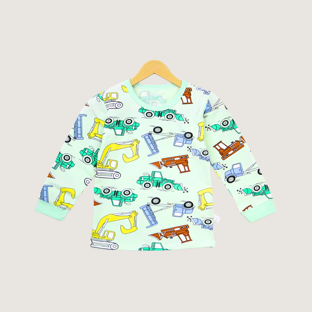 Children's long-sleeve shirt with construction vehicle pattern on a hanger against a light gray background