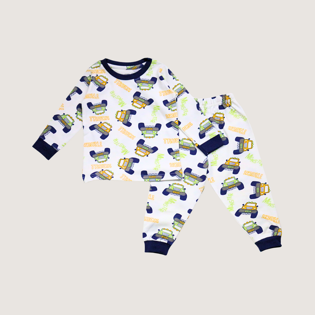 Children's pajama set with vehicle pattern on a light gray background