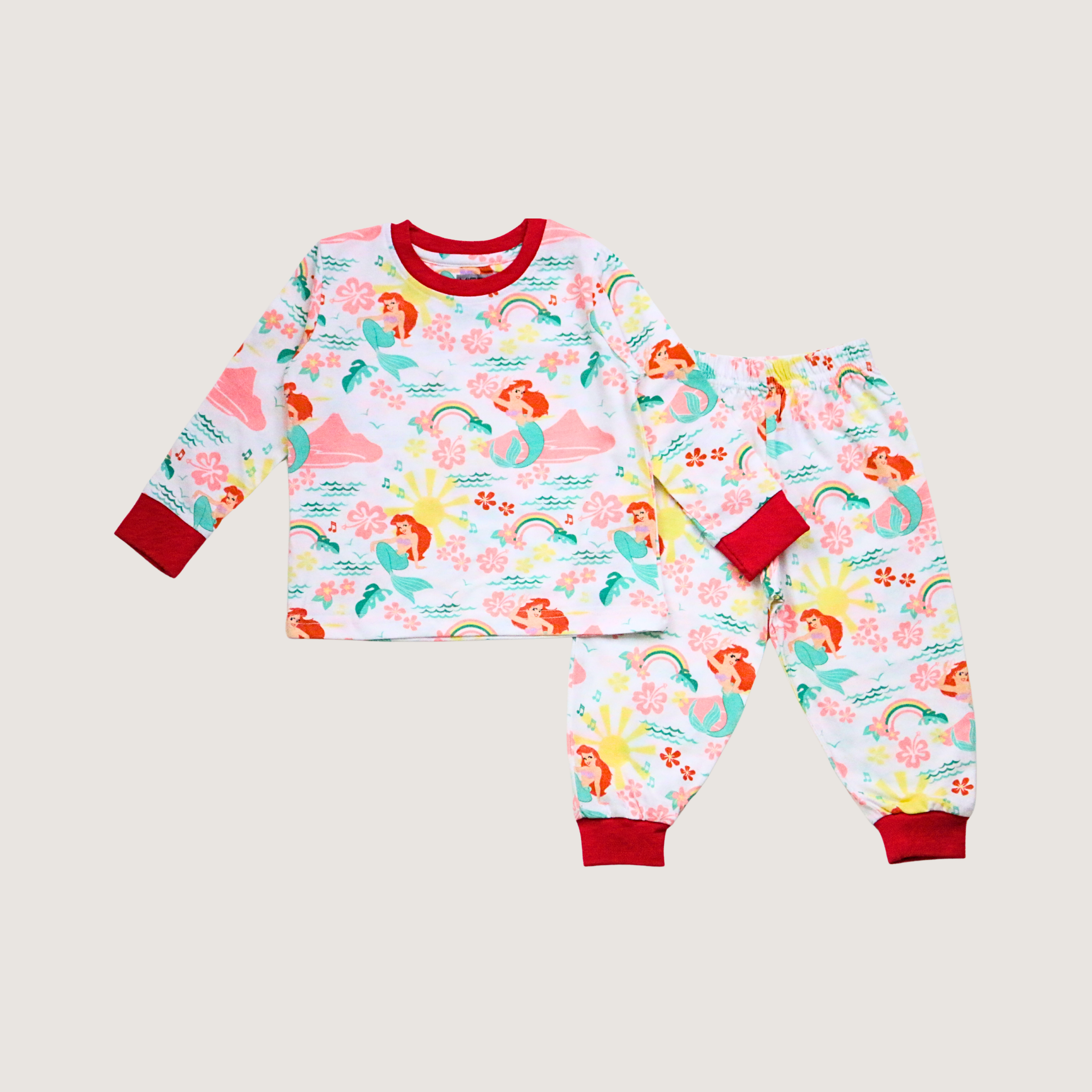 Children's pajama set with mermaid pattern on a light gray background