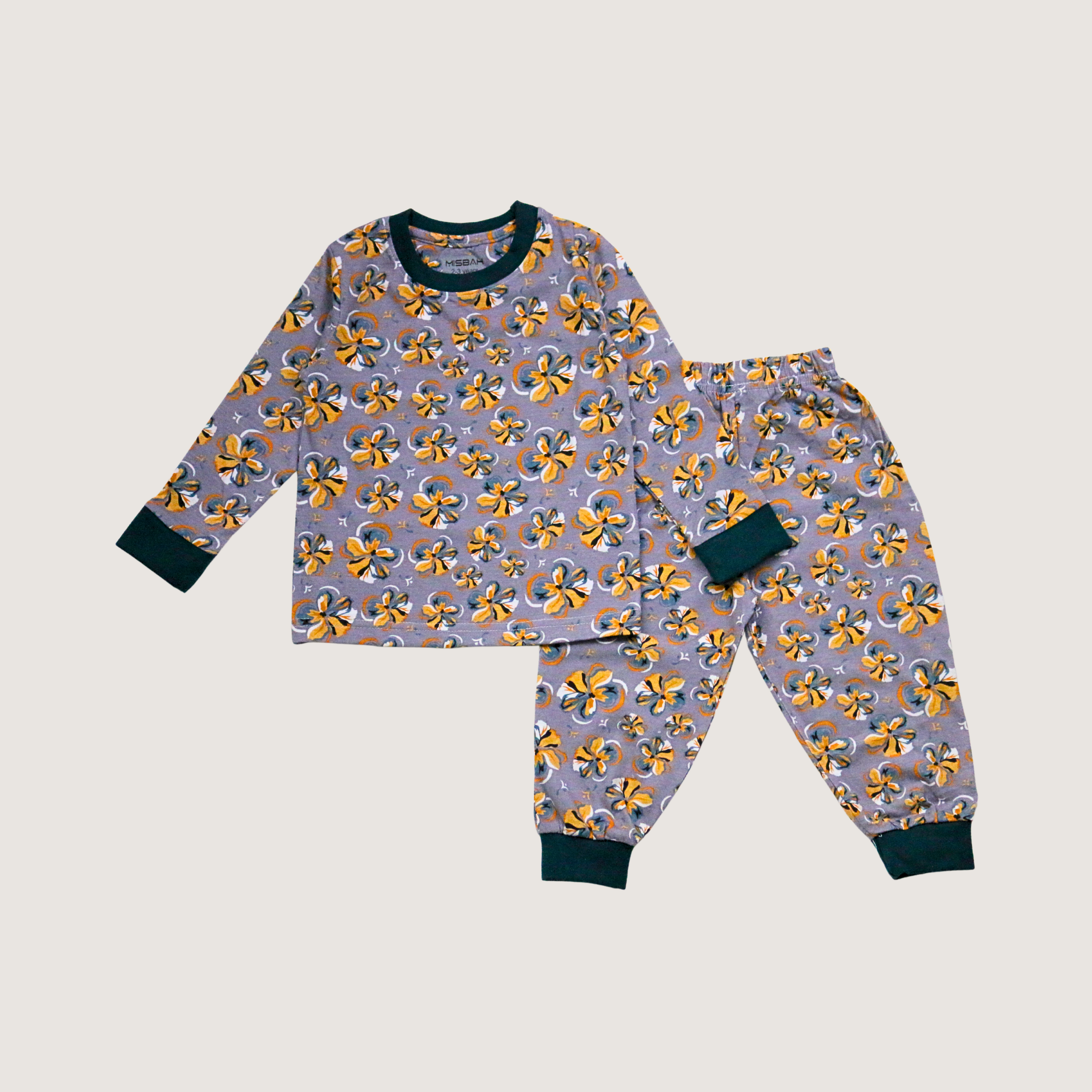 Children's pajama set with yellow floral pattern on a light gray background