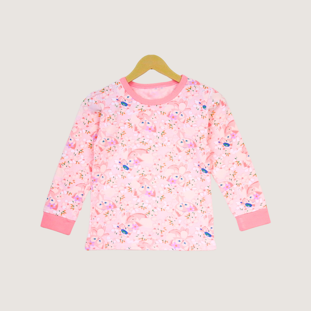 Pink children's long-sleeve shirt with a floral pattern on a beige background