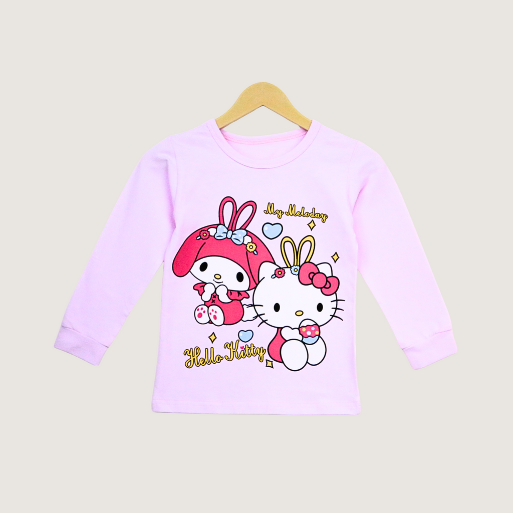 Pink long-sleeve shirt with Hello Kitty design on a beige background