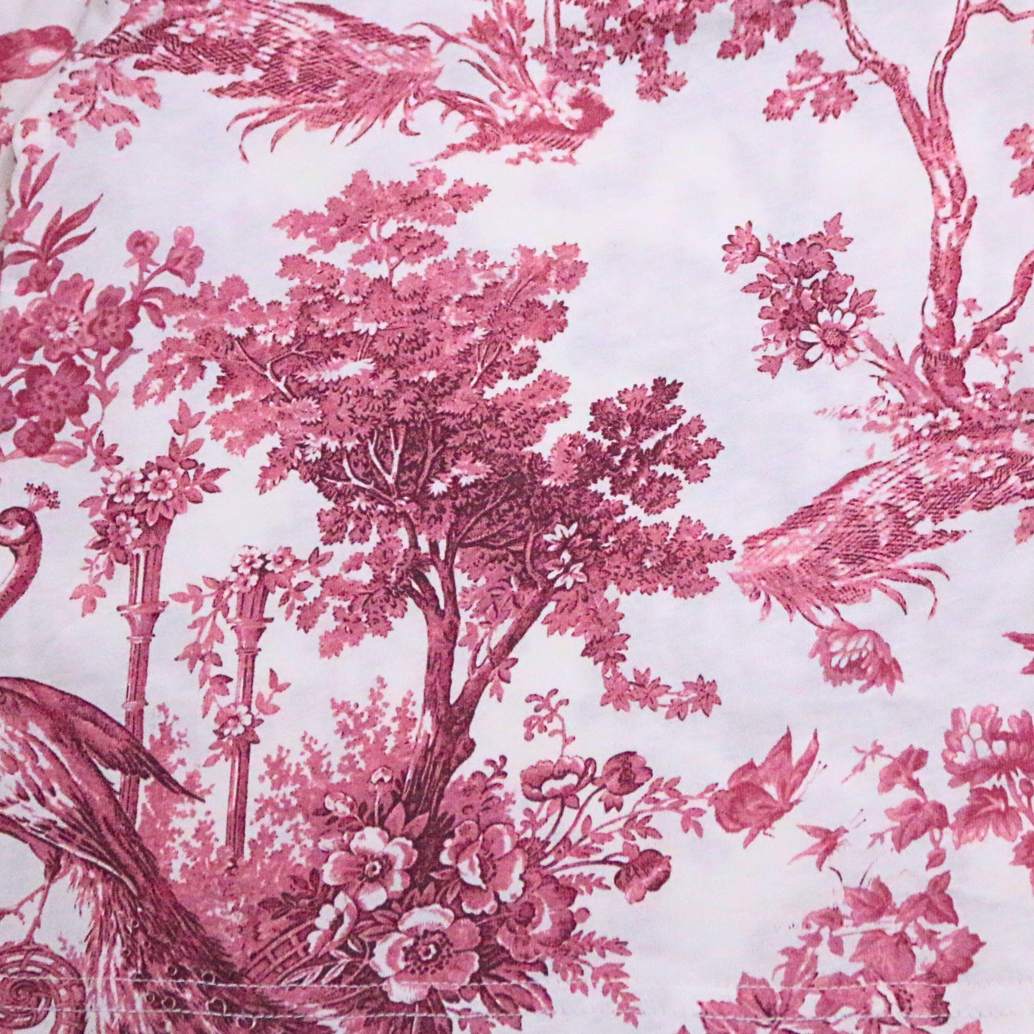 Pink floral and bird pattern on a white background