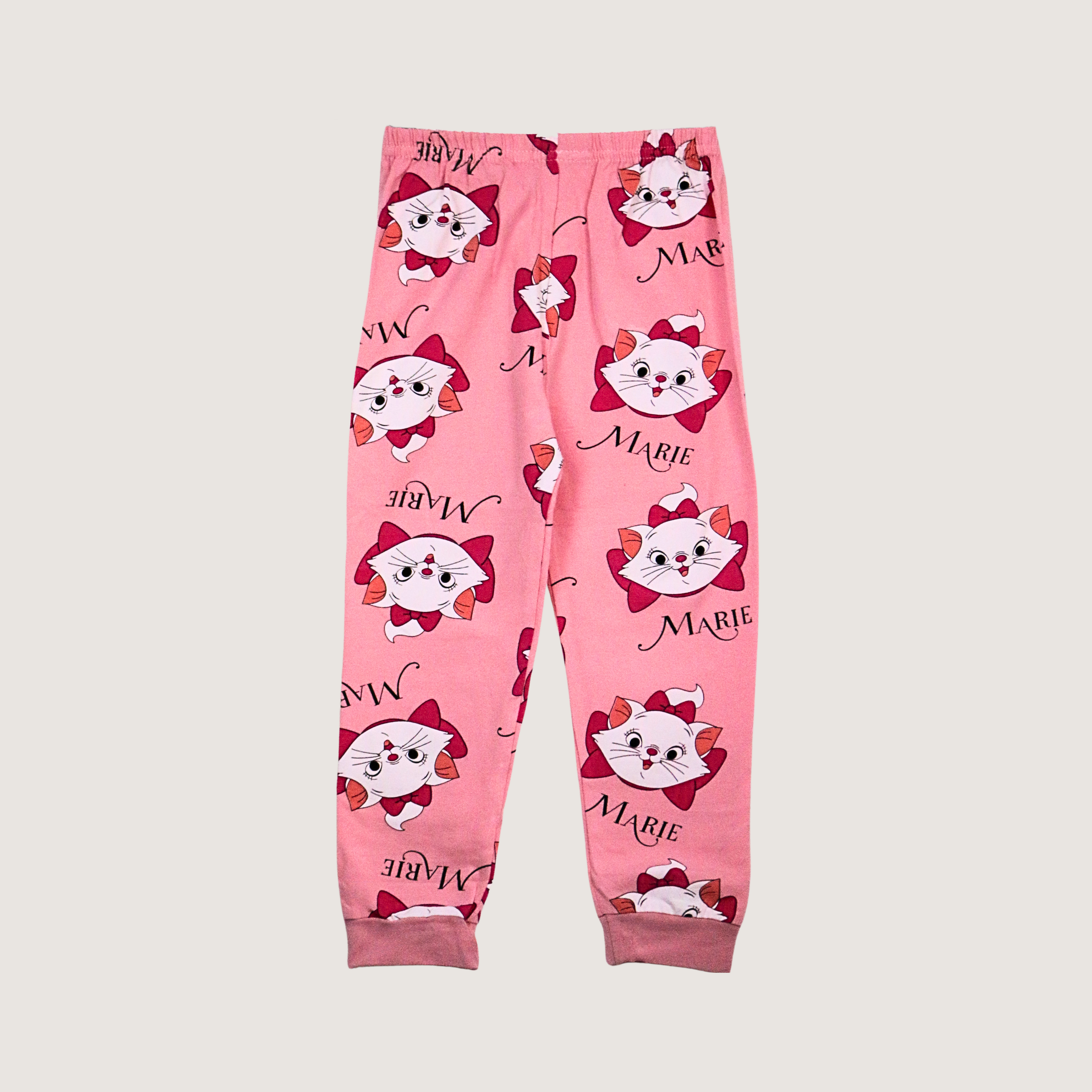 Pink pajama pants with cartoon character design on a light gray background