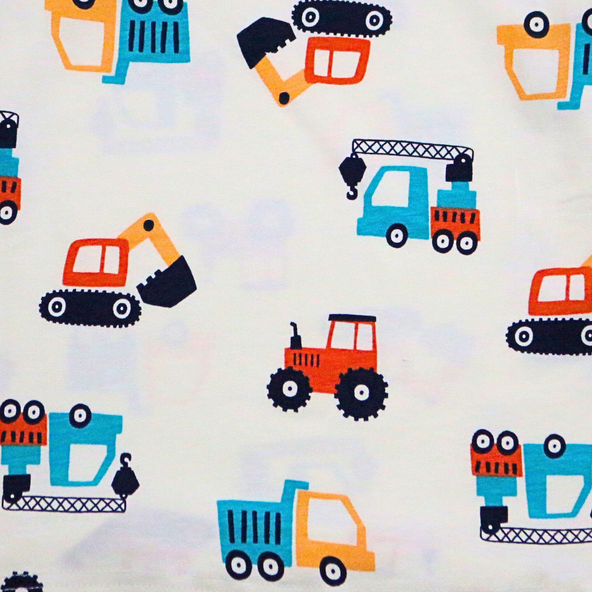 Pattern of colorful construction vehicle toys on a light background