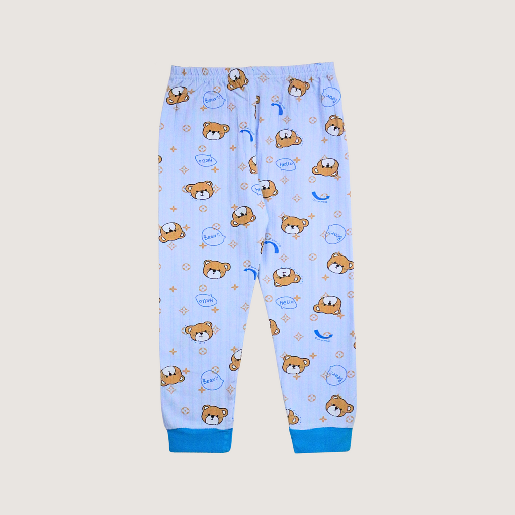 Children's pajama pants with teddy bear pattern on a light blue background