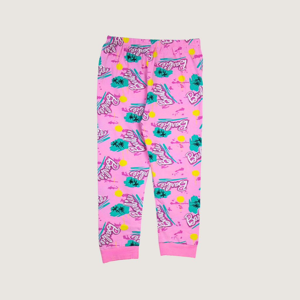 Pink leggings with Barbie logo and graphics on a light gray background