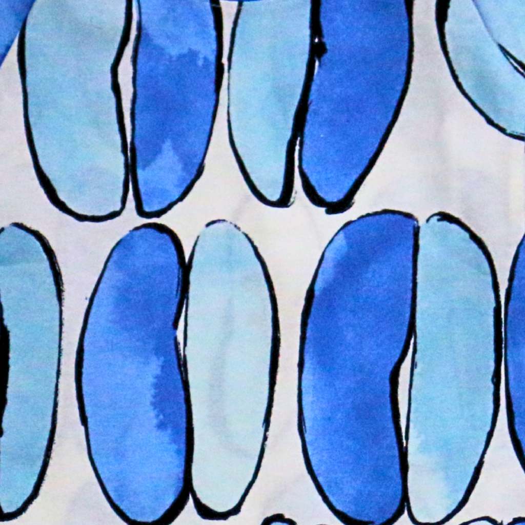 Pattern of blue oval shapes on a light background
