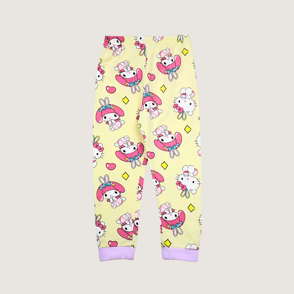 Yellow pajama pants with cartoon character pattern on a white background