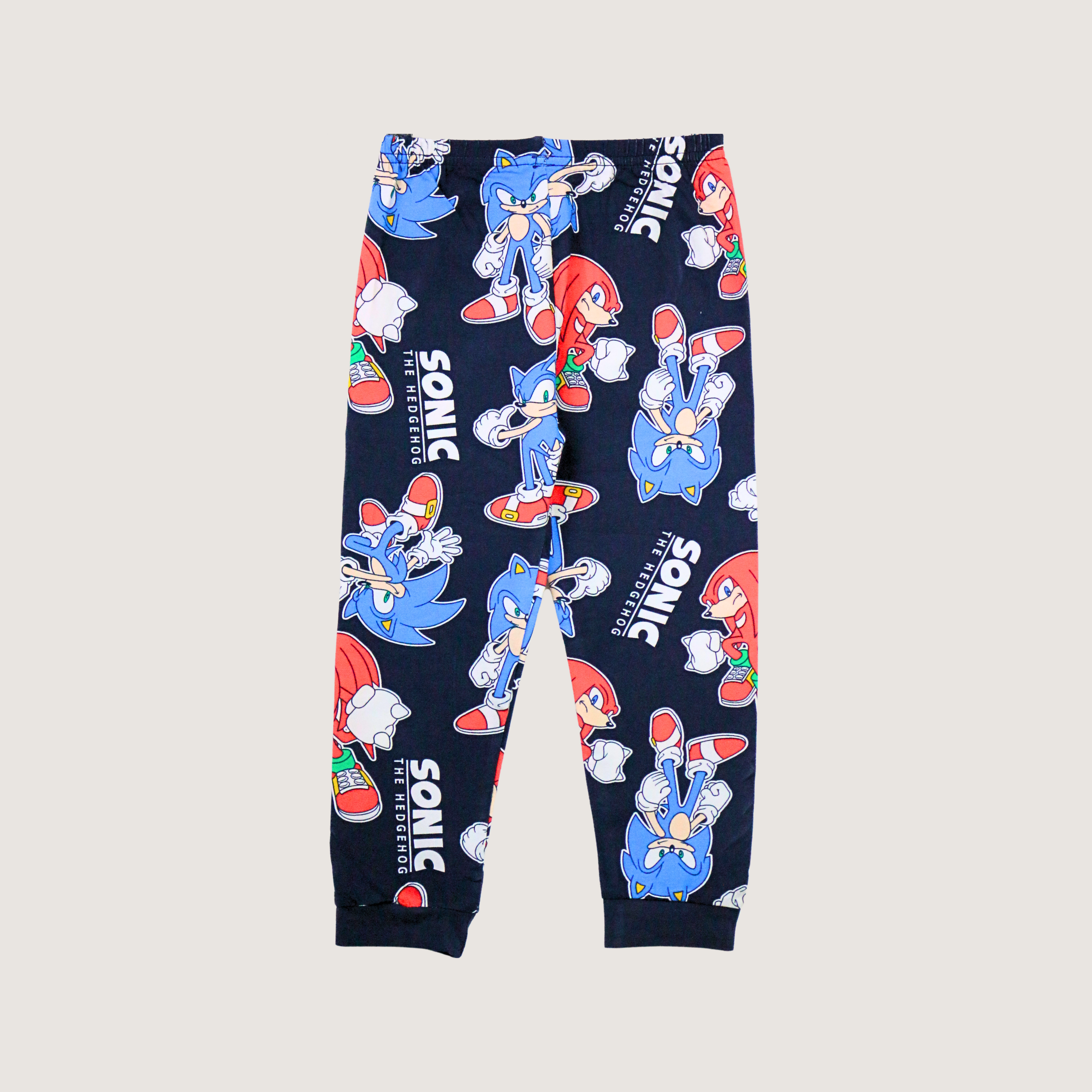 Navy blue jogger pants with Sonic the Hedgehog character print on a light gray background