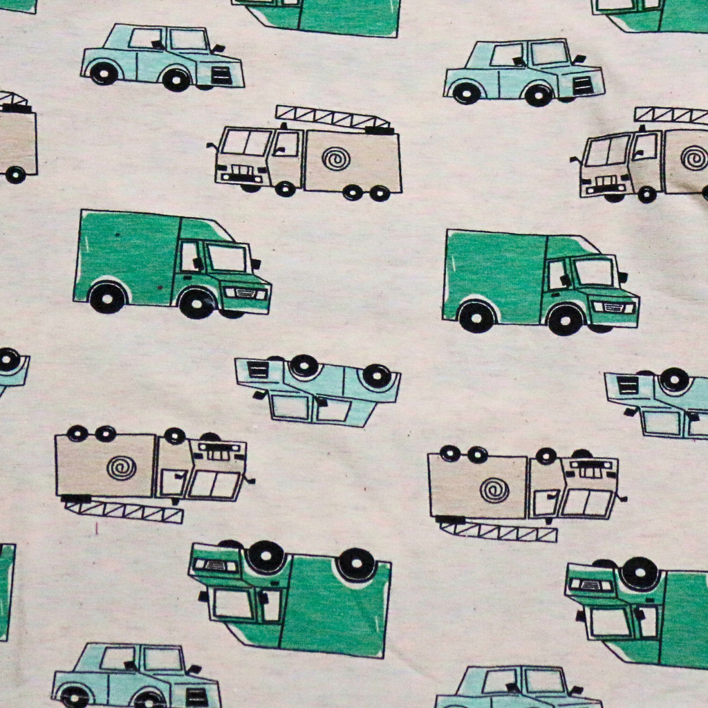 Pattern of green and black vehicles on a beige background