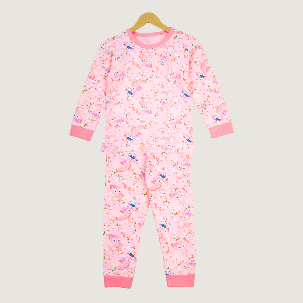 Pink children's pajama set with a floral pattern on a beige background