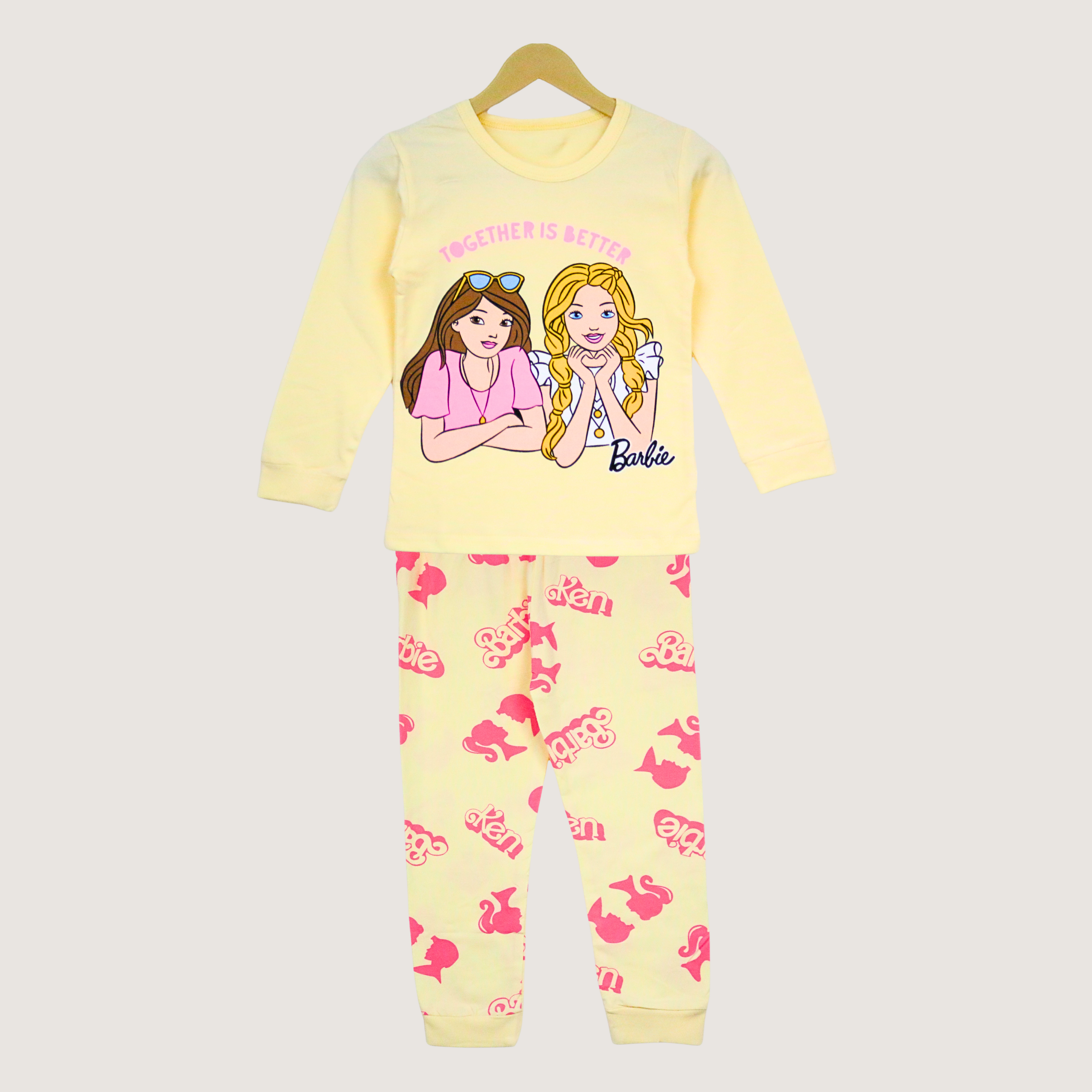 Barbie-themed pajama set on a hanger with a plain background