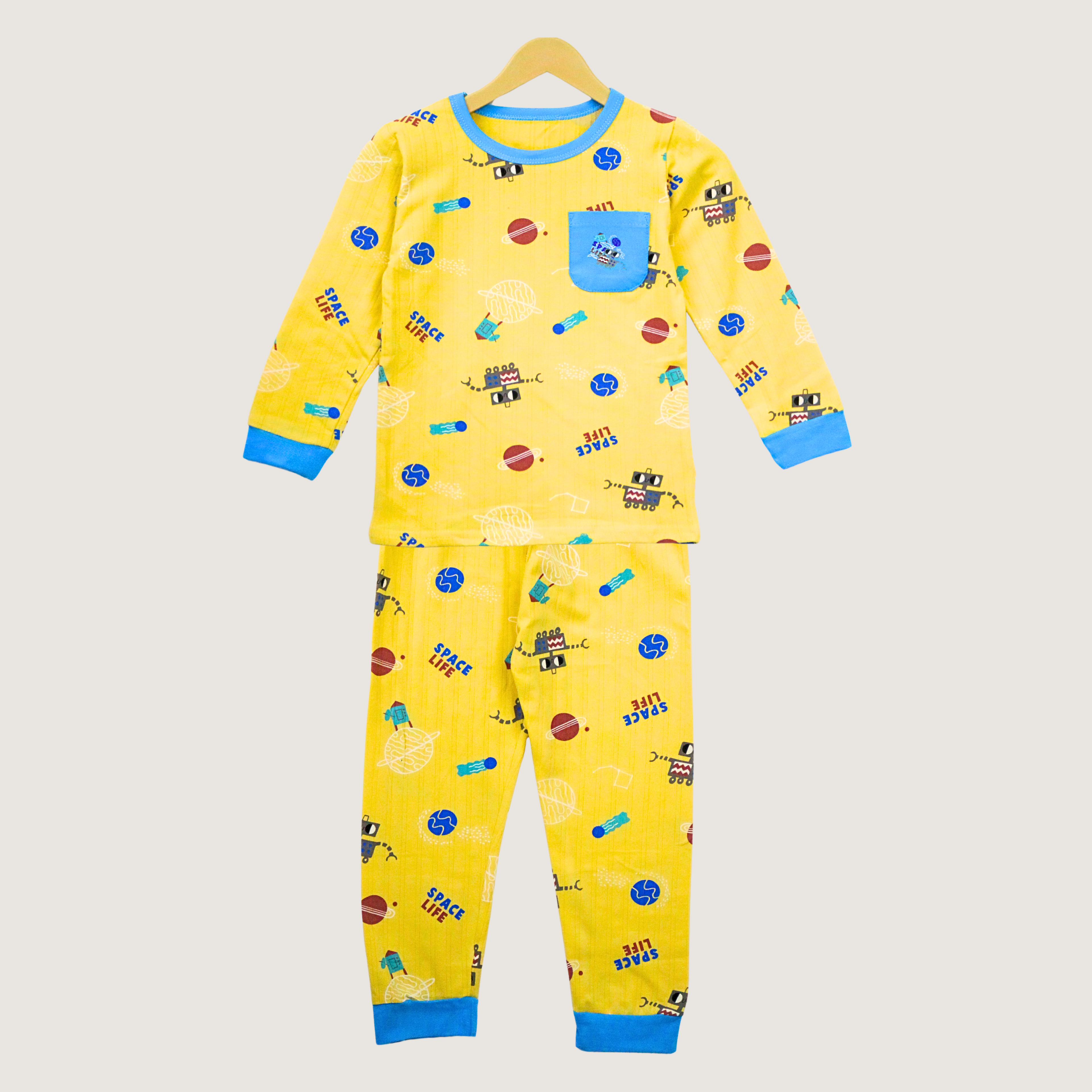 Yellow children's pajama set with space-themed design on a white background