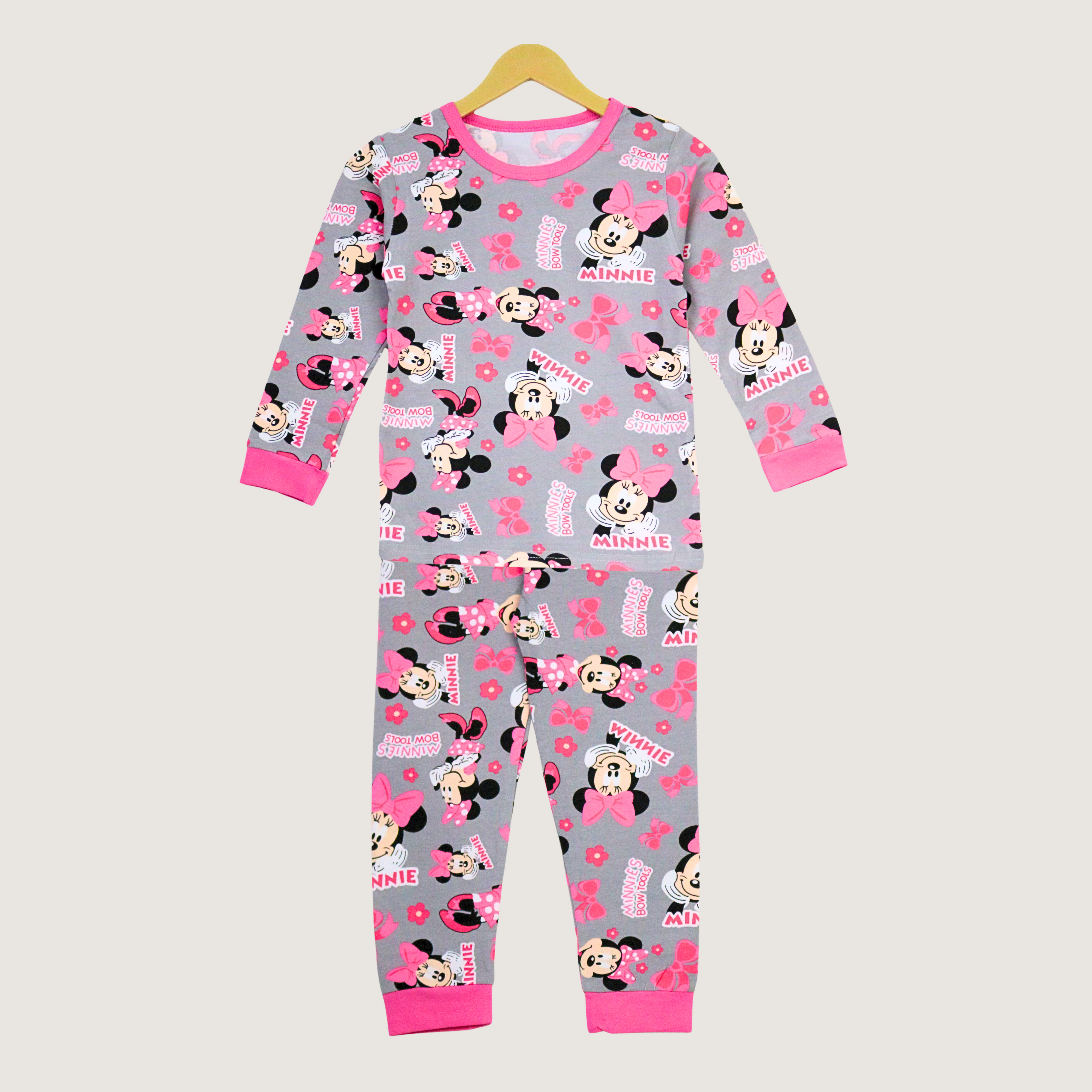 Children's pajama set with Minnie Mouse pattern on a gray background