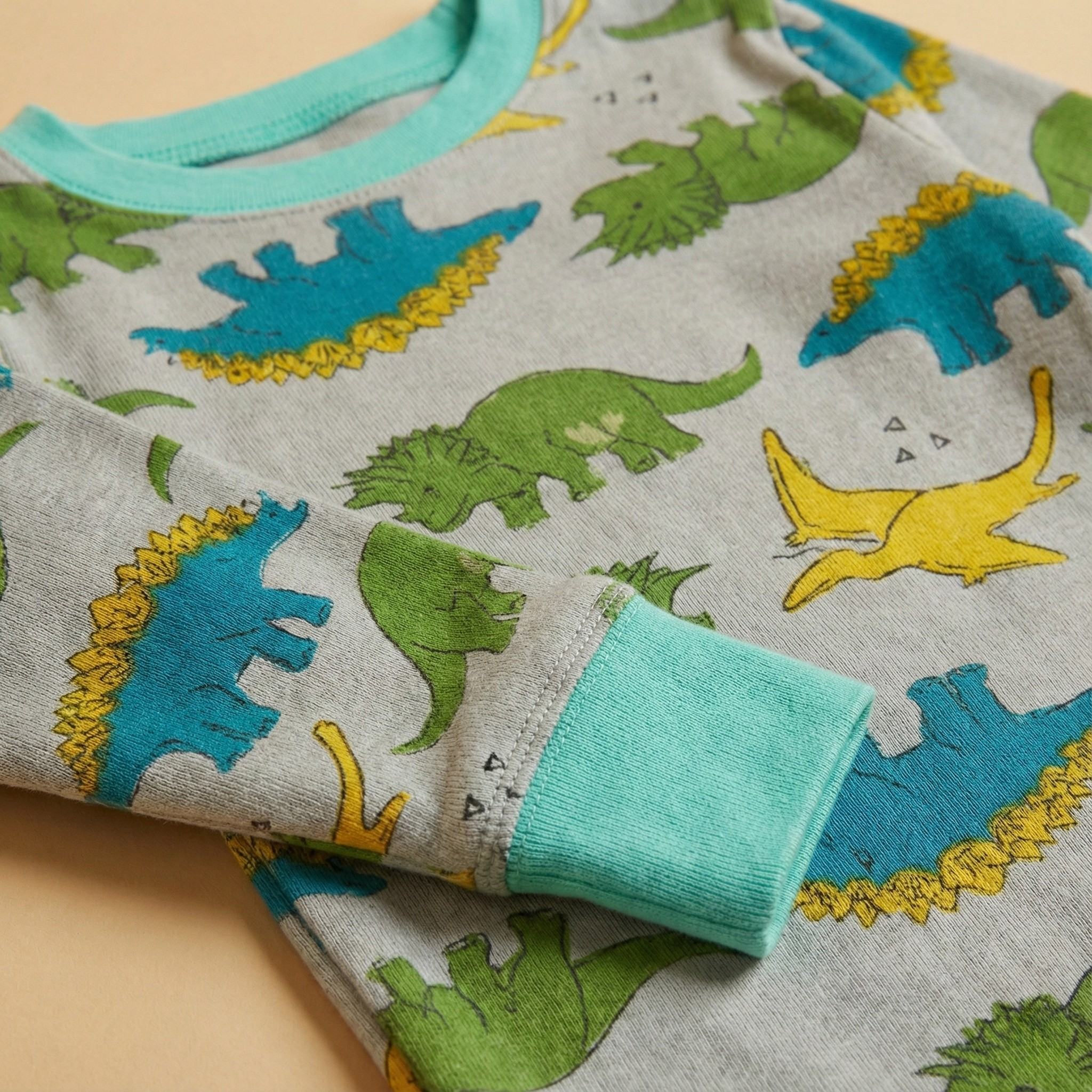 بيجاما حرارية رمادية متعددة الألوان بأكمام طويلة بنقشة الديناصورات (للجنسين)