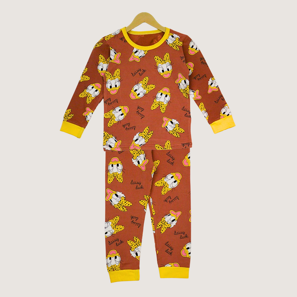 Children's pajama set with cartoon character pattern on a beige background