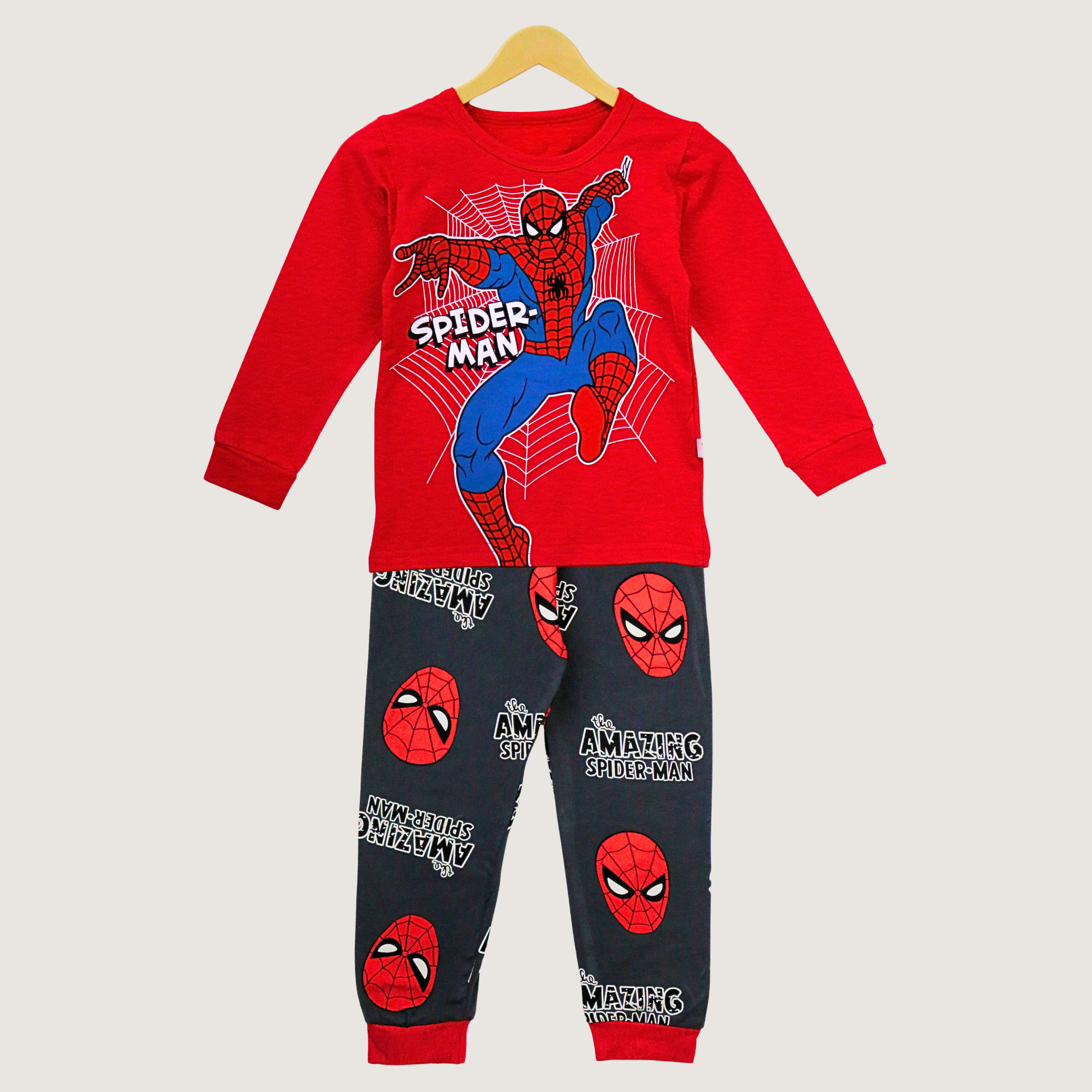 Spider-Man pajama set on a hanger with a plain background