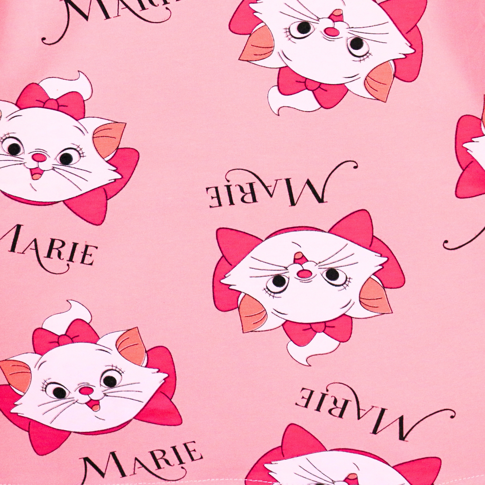 Pattern of a cartoon cat character with 'Marie' text on a pink background