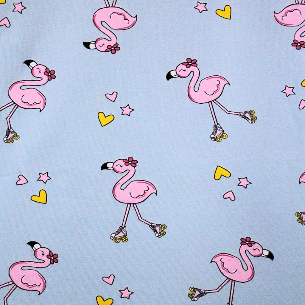 Pattern of pink flamingos on roller skates with hearts and stars on a light blue background